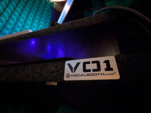 VO1 plaque is displayed marking the booth model. VOCALBOOTH.COM is displayed underneath.